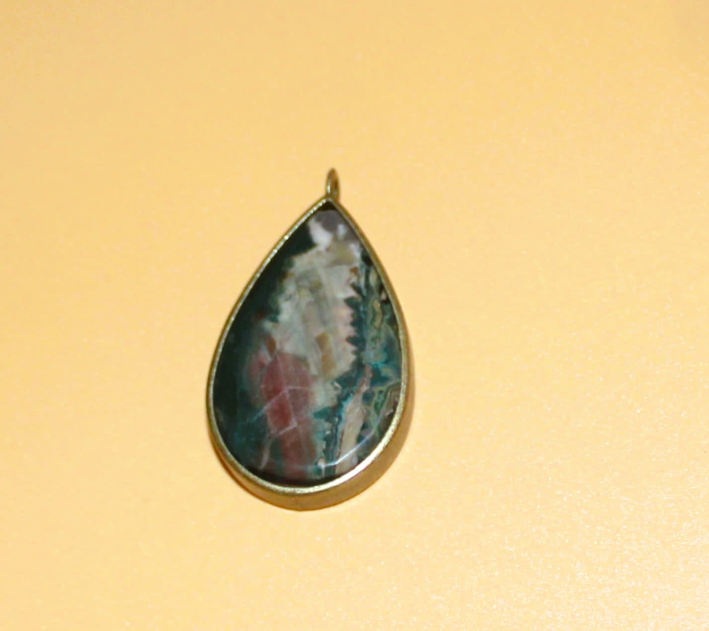 Idaho Sunset Jasper Gemstone in a brass teardrop setting (#106)